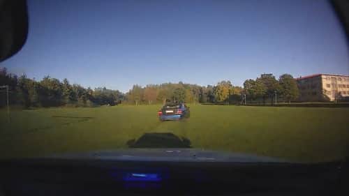 Car chase on soccer field